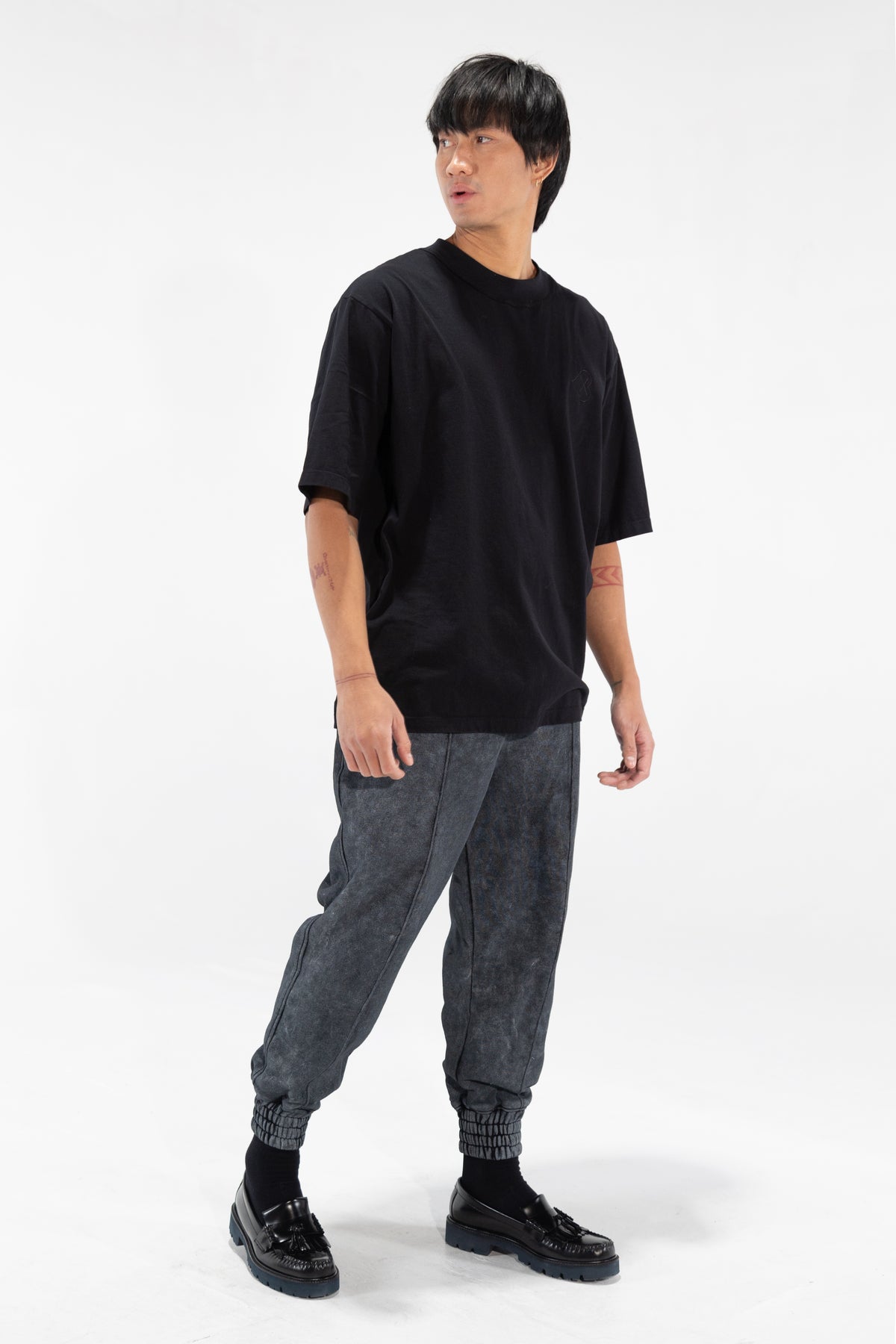 Black Broad Collar Tee shown on model, three-quarter view