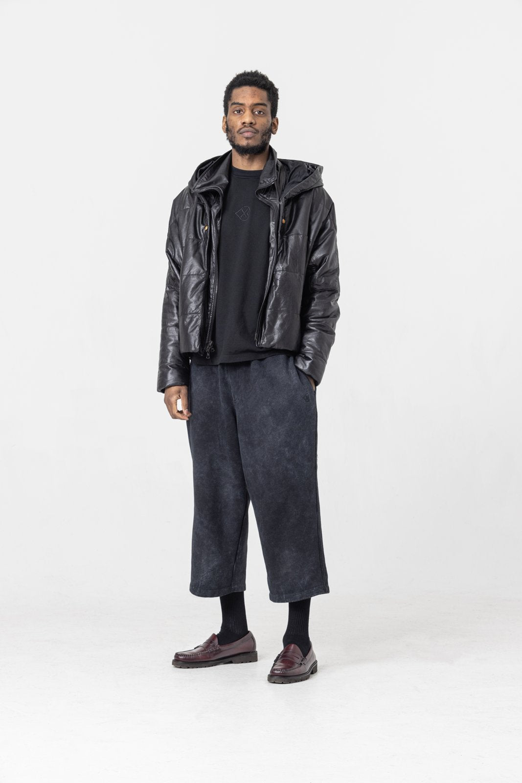 Cropped leather puffer jacket — front view on model