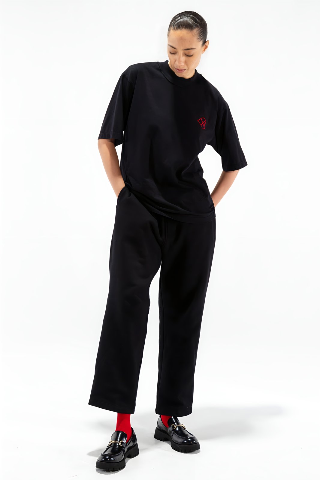 Black straight-leg sweatpants — front view on model